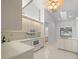 Bright kitchen featuring white cabinets, quartz countertops, modern appliances, and tile floors at 8150 Sw 108Th St, Ocala, FL 34481
