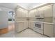 Bright kitchen featuring white appliances and ample cabinet space for storage solutions at 8150 Sw 108Th St, Ocala, FL 34481