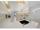 Bright kitchen featuring white cabinets, quartz countertops, and modern appliances at 8150 Sw 108Th St, Ocala, FL 34481