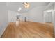 Large open living room with beautiful hardwood floors, high ceiling, and a ceiling fan at 8150 Sw 108Th St, Ocala, FL 34481