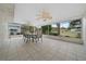 Enclosed sunroom provides serene views and features tile flooring and ceiling fans at 8150 Sw 108Th St, Ocala, FL 34481