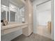 Elegant vanity area adjacent to the bedroom with storage and a view into the bathroom at 8150 Sw 108Th St, Ocala, FL 34481