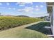 This backyard has lush green landscaping, and privacy hedges perfect for enjoying the outdoors in peace at 10927 Se 168Th Loop, Summerfield, FL 34491