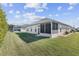 This home features a spacious backyard and screened-in lanai, ideal for outdoor relaxation and entertaining at 10927 Se 168Th Loop, Summerfield, FL 34491