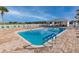 Bright community pool featuring plenty of seating, an overhang, and a calming place to relax at 10927 Se 168Th Loop, Summerfield, FL 34491