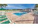 Relax by the community pool with ample seating and a covered area for shade, perfect for hot days at 10927 Se 168Th Loop, Summerfield, FL 34491
