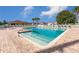 Enjoy a refreshing swim in this community pool, complete with lounge chairs and ample deck space at 10927 Se 168Th Loop, Summerfield, FL 34491