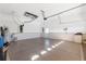 Spacious two-car garage with white walls and ample room for parking and storage at 10927 Se 168Th Loop, Summerfield, FL 34491