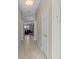 Hallway showcasing archway and tile floors leading into living area with natural light at 10927 Se 168Th Loop, Summerfield, FL 34491