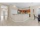 Kitchen featuring breakfast bar, stainless steel appliances, and ample counter space at 10927 Se 168Th Loop, Summerfield, FL 34491