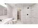 Modern bathroom with white vanity, marble shower, and linen closet at 11 Emerald Trl, Ocala, FL 34472