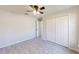 Bright bedroom with ceiling fan and double closet at 11 Emerald Trl, Ocala, FL 34472