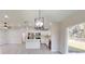 Open dining area with kitchen island and view to the backyard at 11 Emerald Trl, Ocala, FL 34472