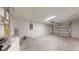 Unfinished garage with automatic opener and room for storage at 11 Emerald Trl, Ocala, FL 34472