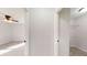 Bright hallway with doors to bedrooms and laundry room at 11 Emerald Trl, Ocala, FL 34472