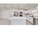 Modern kitchen with white cabinets and a large island at 11 Emerald Trl, Ocala, FL 34472