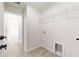 Laundry room with garage access and built-in shelving at 11 Emerald Trl, Ocala, FL 34472