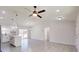 Bright living room with tile floors and ceiling fan at 11 Emerald Trl, Ocala, FL 34472