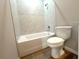 Bathroom features a shower-tub combo with tiled walls and modern fixtures at 14711 Sw 69Th Court Rd, Ocala, FL 34473