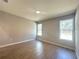 Light-filled bedroom with tile flooring and large windows overlooking the property at 14711 Sw 69Th Court Rd, Ocala, FL 34473