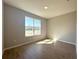 Bedroom with wood-look tile flooring and a large window at 14711 Sw 69Th Court Rd, Ocala, FL 34473