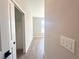 Bedroom with closet and window showcasing wood-look tile flooring at 14711 Sw 69Th Court Rd, Ocala, FL 34473
