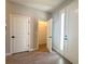 Hallway with wood-look tile flooring leading to a closet at 14711 Sw 69Th Court Rd, Ocala, FL 34473