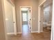 Hallway showing doors and transitions to other rooms with consistent neutral color scheme at 14711 Sw 69Th Court Rd, Ocala, FL 34473