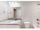 Bright bathroom featuring granite countertops, a modern sink, and a shower-tub combination at 21114 Sw Peach Blossom St, Dunnellon, FL 34431
