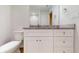 Bathroom featuring granite countertop vanity, a mirror and plenty of storage at 21114 Sw Peach Blossom St, Dunnellon, FL 34431