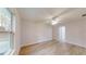 Bedroom featuring hard wood floors and ceiling fan with natural lighting from the windows at 21114 Sw Peach Blossom St, Dunnellon, FL 34431