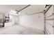 Spacious garage with water heater and a door leading to the interior of the home at 21114 Sw Peach Blossom St, Dunnellon, FL 34431