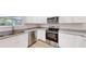Kitchen area featuring granite countertops, stainless steel appliances and abundant cabinetry at 21114 Sw Peach Blossom St, Dunnellon, FL 34431