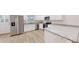 Open kitchen features stainless steel appliances, granite countertops, and white cabinetry at 21114 Sw Peach Blossom St, Dunnellon, FL 34431