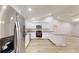 Modern kitchen with stainless steel appliances, granite counters, and new lighting at 21114 Sw Peach Blossom St, Dunnellon, FL 34431