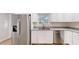 Kitchen features stainless steel appliances, granite countertops, and white cabinets at 21114 Sw Peach Blossom St, Dunnellon, FL 34431