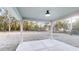 A covered back patio with plenty of backyard space and natural views at 21114 Sw Peach Blossom St, Dunnellon, FL 34431