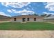 Newly built home with grassy backyard and patio at 22084 Sw Rainbow Lakes Blvd, Dunnellon, FL 34431