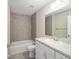 Bathroom with a tub, toilet and white vanity at 22084 Sw Rainbow Lakes Blvd, Dunnellon, FL 34431