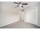 Secondary bedroom with double door closet and carpet flooring at 22084 Sw Rainbow Lakes Blvd, Dunnellon, FL 34431
