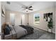 Spacious bedroom with large window and ceiling fan at 22084 Sw Rainbow Lakes Blvd, Dunnellon, FL 34431