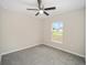 Bright bedroom featuring neutral walls and carpet at 22084 Sw Rainbow Lakes Blvd, Dunnellon, FL 34431