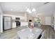 Modern kitchen with stainless steel appliances and an open layout at 22084 Sw Rainbow Lakes Blvd, Dunnellon, FL 34431