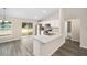 Eat-in kitchen featuring a breakfast bar and view of backyard at 22084 Sw Rainbow Lakes Blvd, Dunnellon, FL 34431