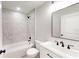 Modern bathroom with marble tile and a white vanity at 227 Oak Lane Cir, Ocala, FL 34472