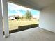 View of the backyard featuring a grass lawn from the covered patio at 2647 Sw 154Th Ln, Ocala, FL 34473