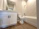 Bathroom features a white vanity with dark hardware and a combined tub and shower at 2647 Sw 154Th Ln, Ocala, FL 34473