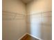 Walk-in closet with wire shelving on three sides at 2647 Sw 154Th Ln, Ocala, FL 34473