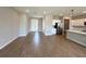 Spacious interior showcasing wood-look tile floors and open floor plan featuring the kitchen and dining areas at 2647 Sw 154Th Ln, Ocala, FL 34473