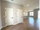 Bright interior showcasing wood-look tile floors, neutral walls, and an open-concept layout to the kitchen at 2647 Sw 154Th Ln, Ocala, FL 34473